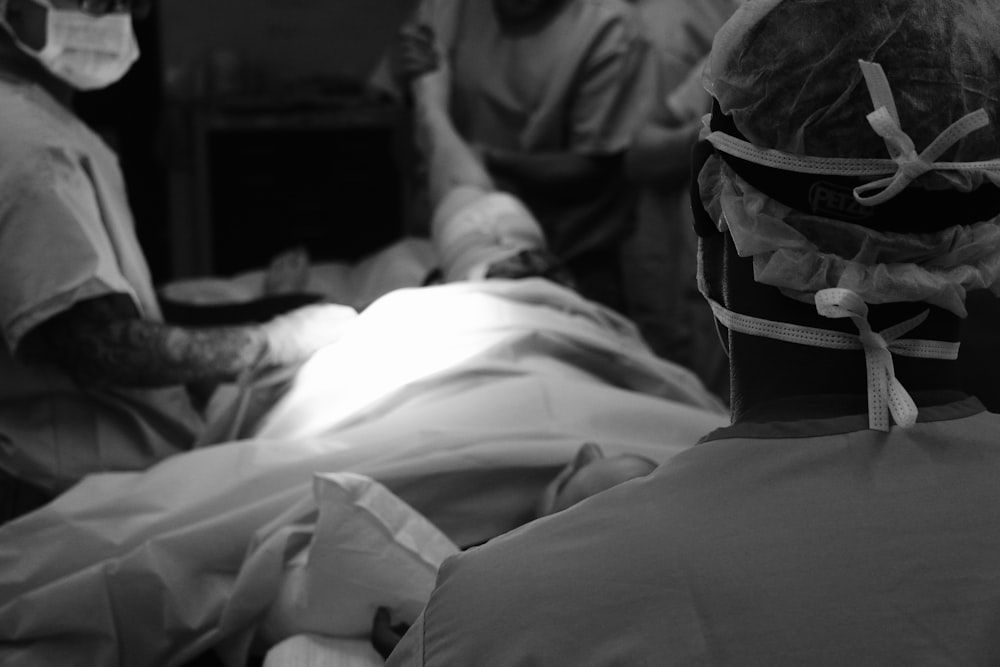 a group of doctors performing surgery on a patient