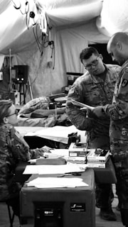 three soldier talking inside room