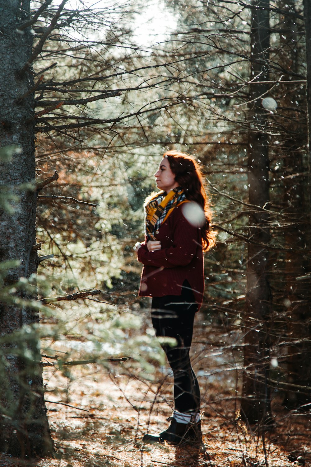 woman standing near tree during daytime