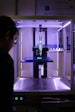 person near 3D printer