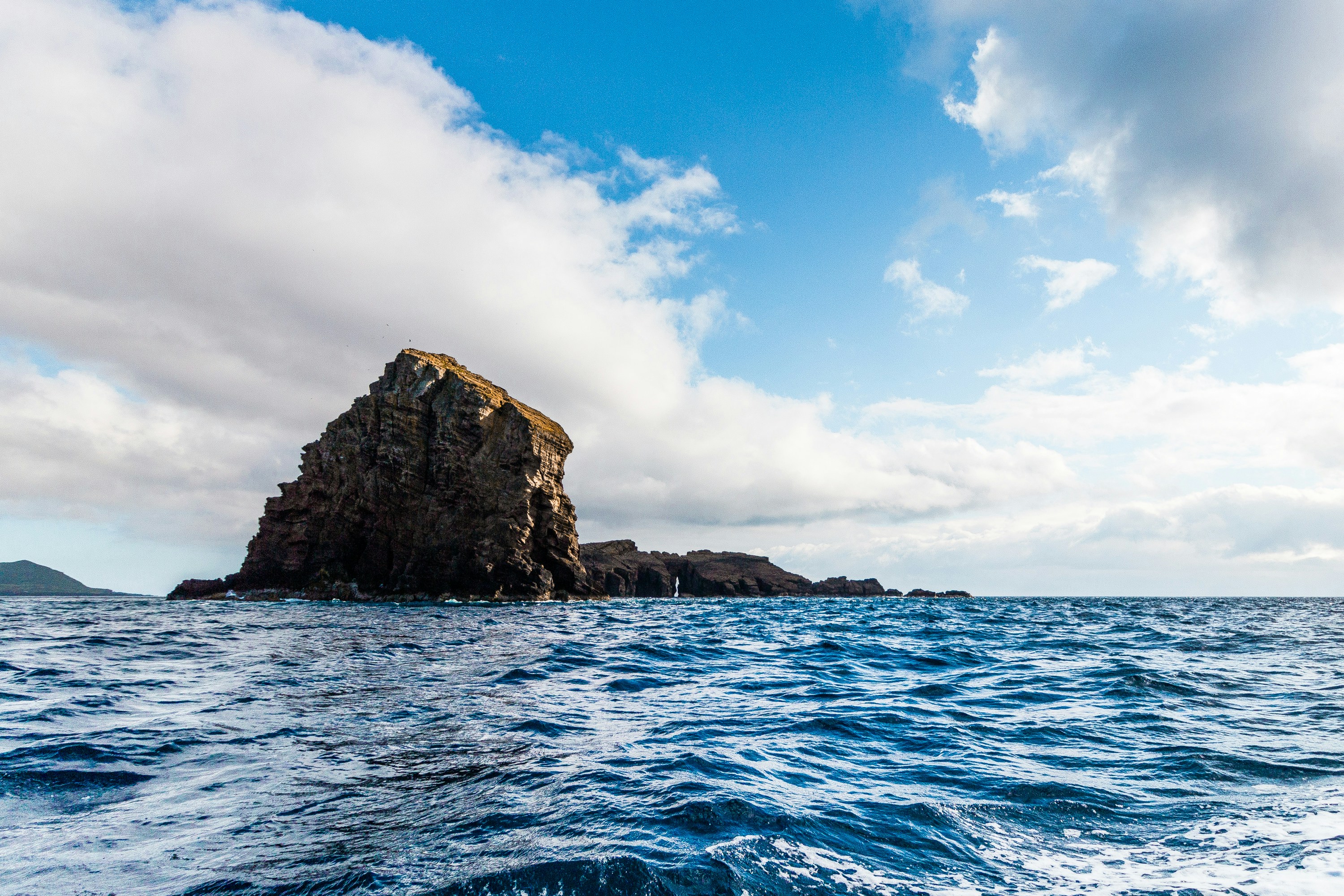 body of water and rock formation
