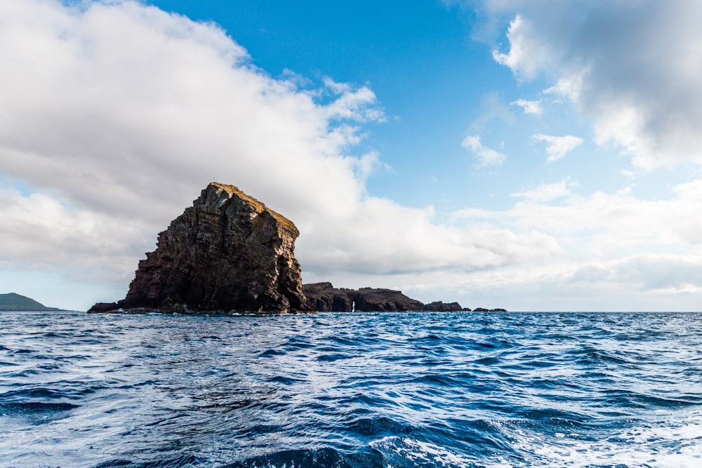 body of water and rock formation