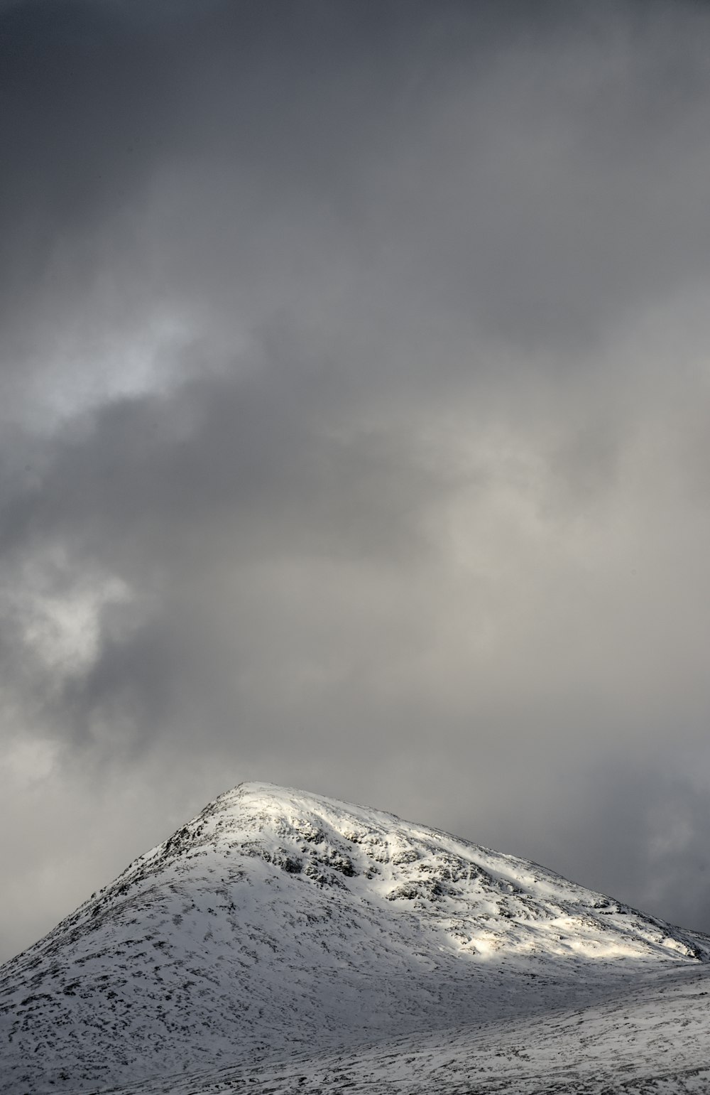 mountain under clouds