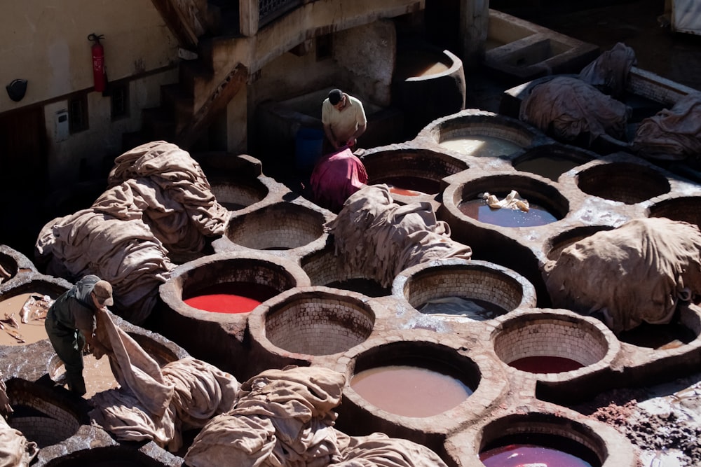 man holding brown textiles at daytime