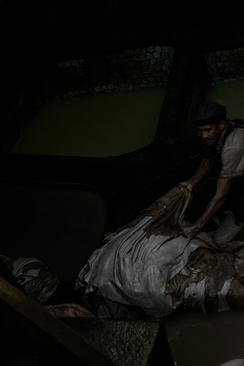 man holding brown and white textile