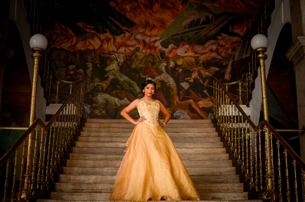 woman wearing brown dress standing on stair