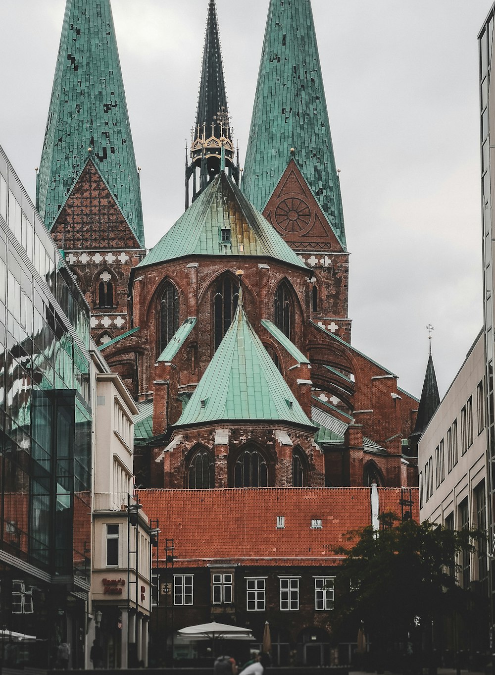 orange and teal building under white clouds