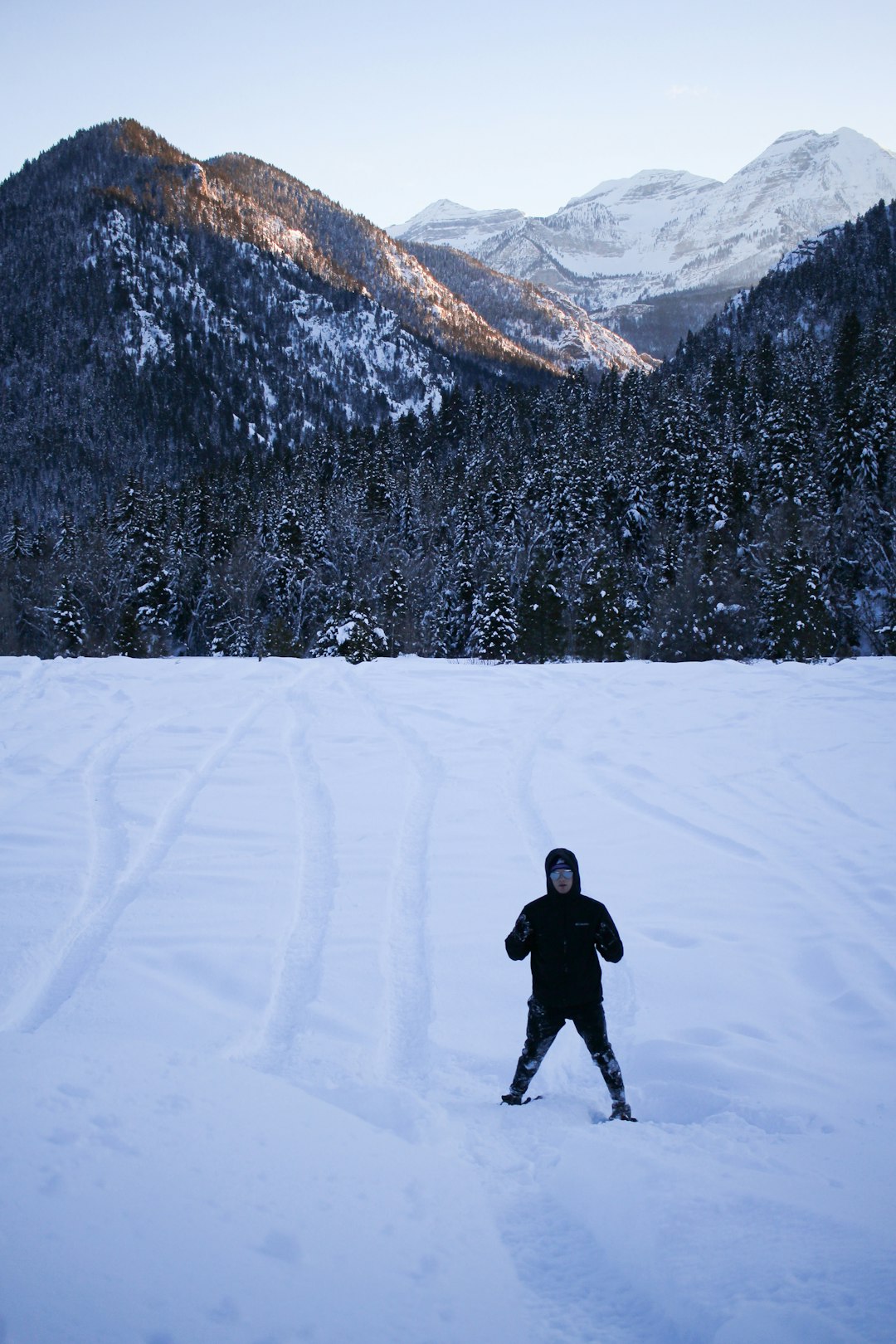 man standing on snow-covered ground