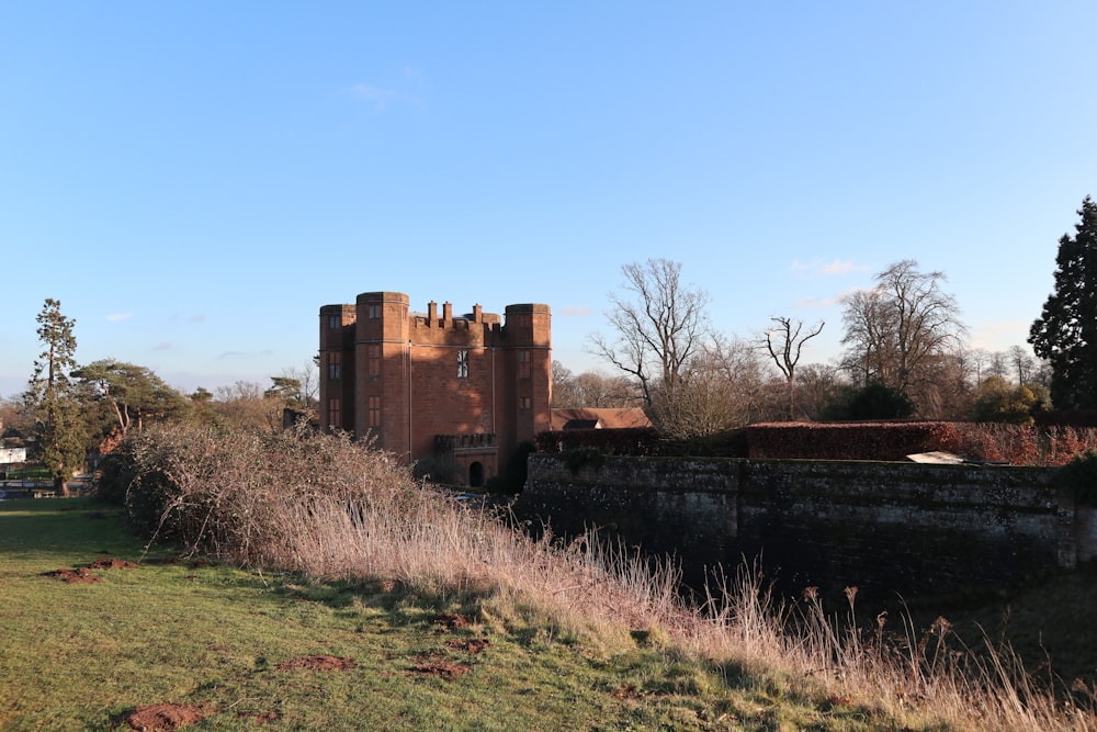 brown castle in the middle of the field