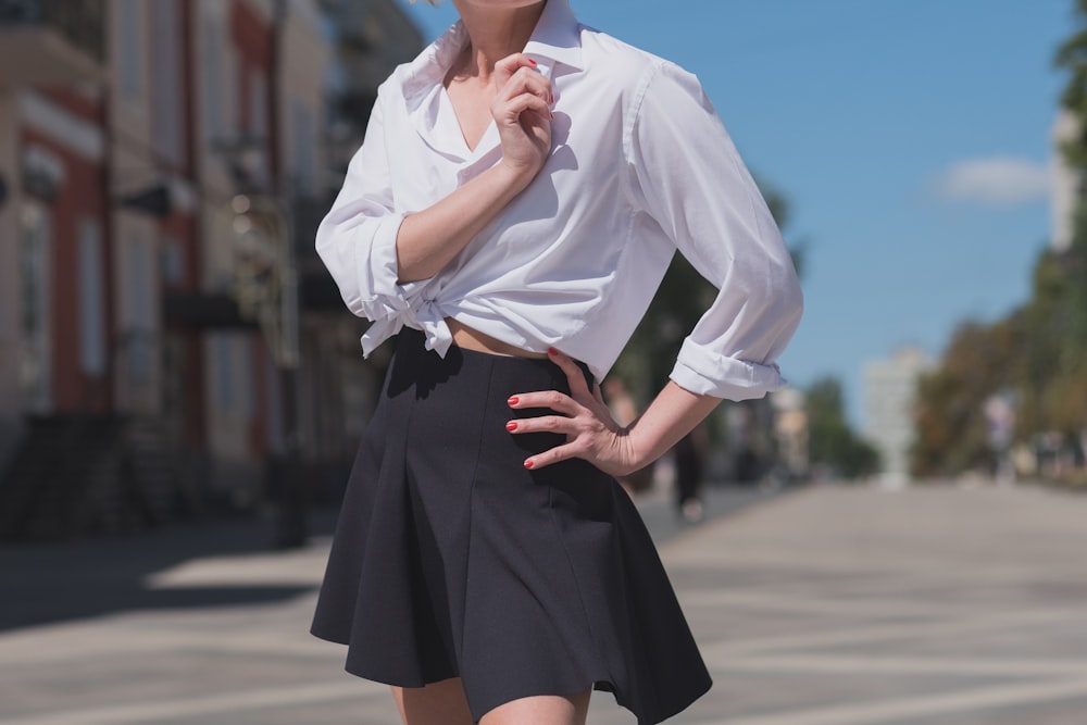 woman standing at middle of road