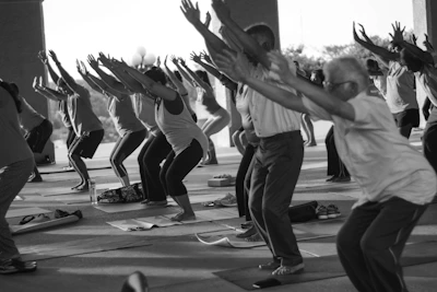 grayscale photo of people exercising