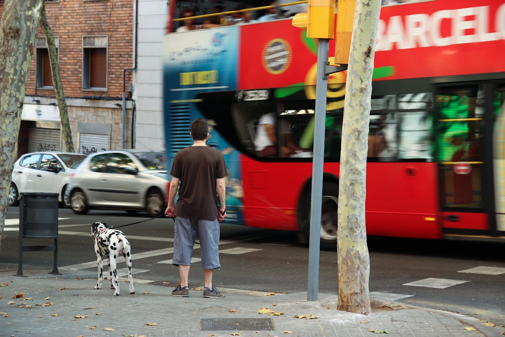 man with dog near street