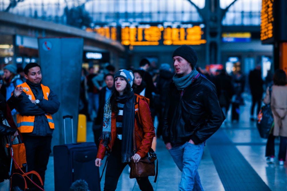 man walking beside woman during daytime