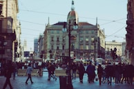 A candid street scene showing vibrant life and movement in a European city.