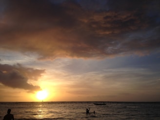 Sunset casting golden hues over a lively social play session at Sweet Spot Tobago.