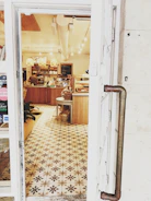 Cozy cafe interior showcasing decorative laminates and warm wooden flooring