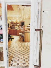 A cozy cafe interior featuring warm-toned laminate flooring.