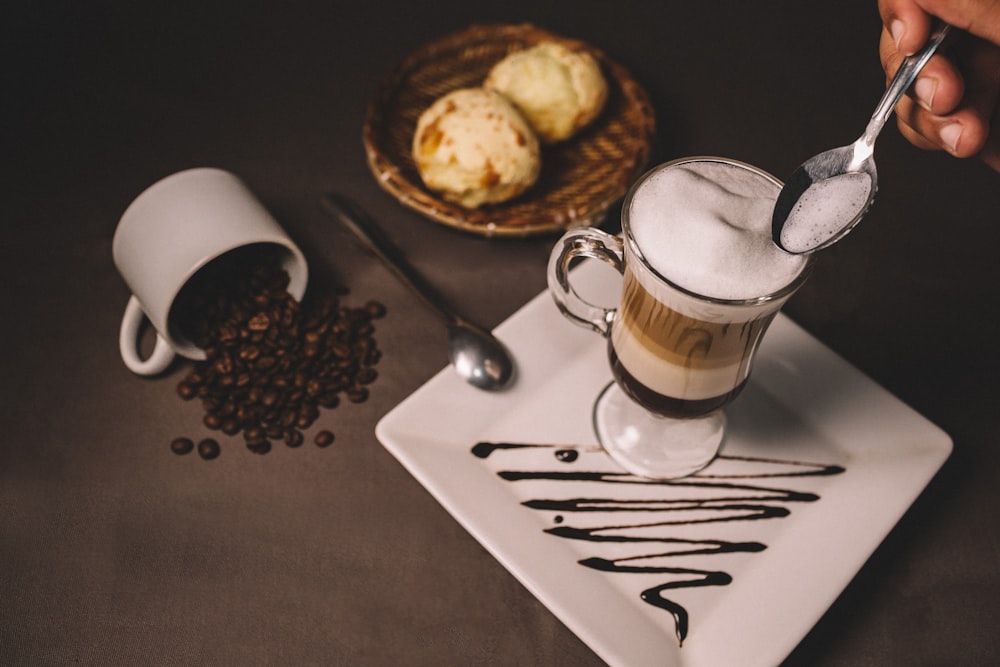 brown liquid in glass mug