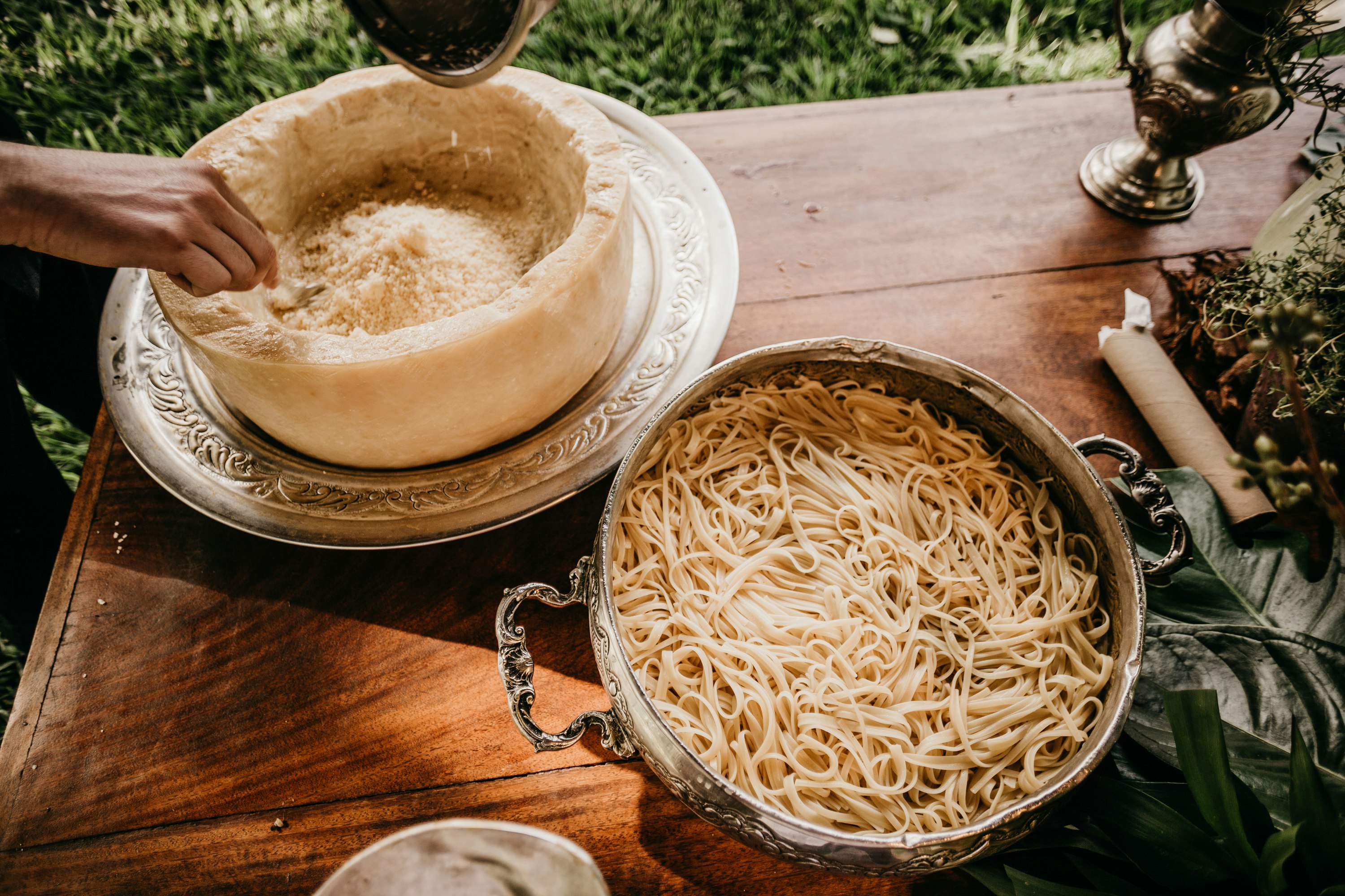 pasta in cooking pot on brown wooden table