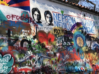 assorted-color graffiti on gray wall
