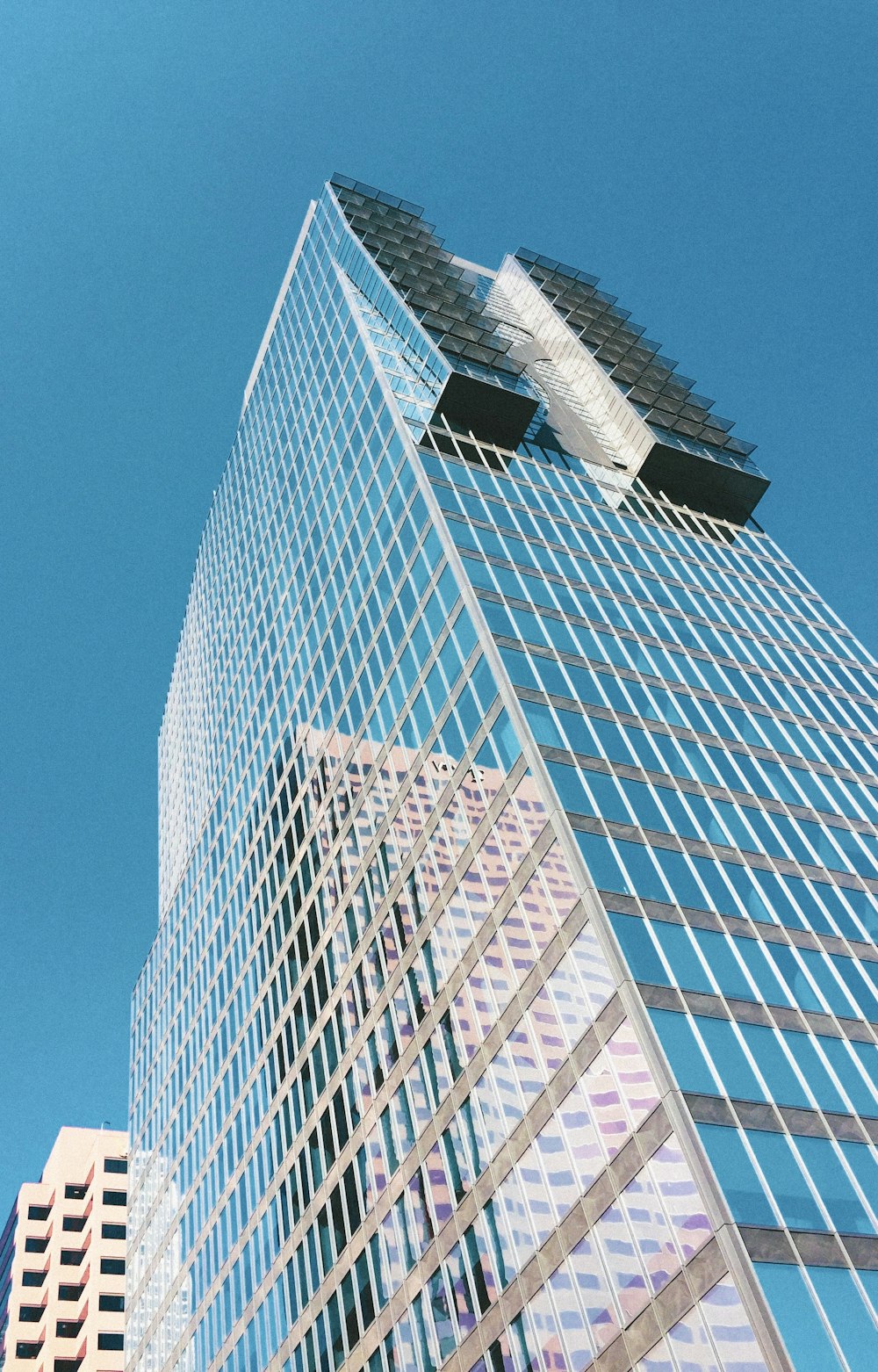 low angle photo of curtain glass wall builfing