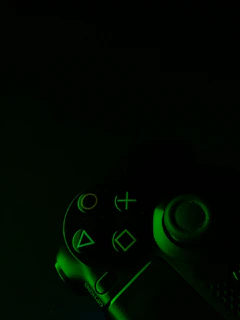 A vibrant android gaming controller illuminated with colorful LED lights on a dark surface.