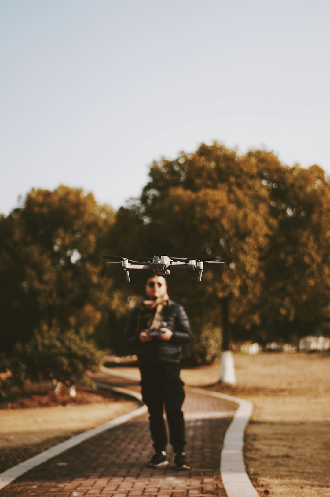 man standing near drone