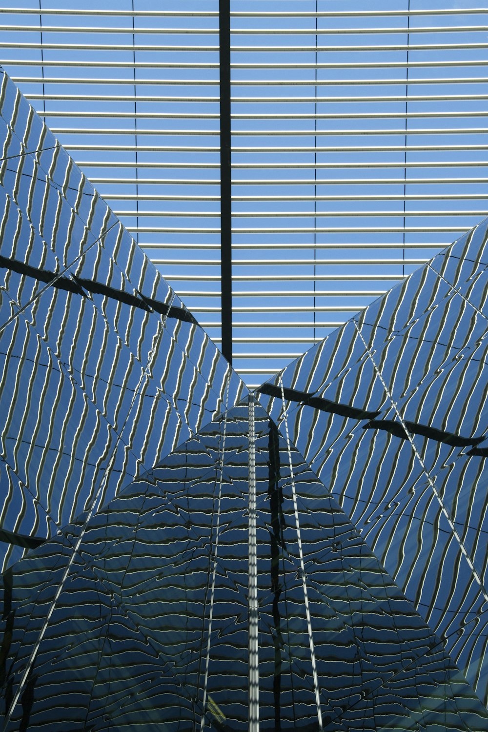 blue and white glass building close-up photography