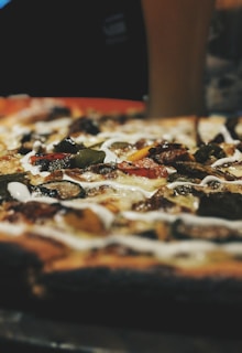 A close-up of a slice of pizza showcasing its toppings.
