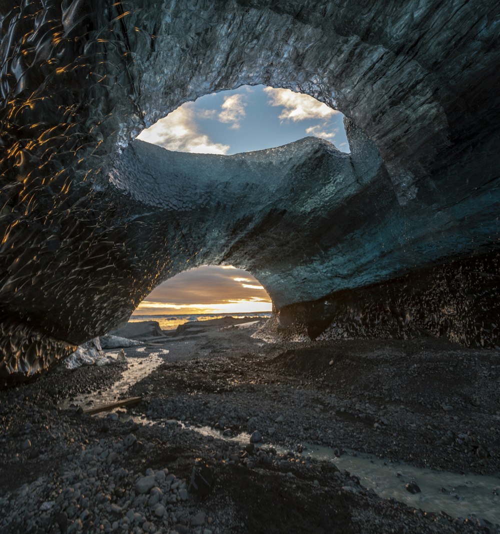 gray stone cave during golden hour