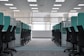 empty black rolling chairs at cubicles