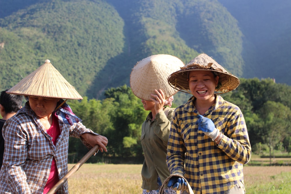 two woman wearing gray hat