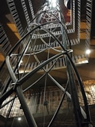 Close-up of a modern mezzanine metal structure inside a commercial building.