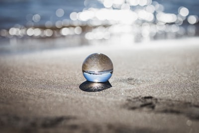 clear toy marble with reflection of seashore clear google meet background