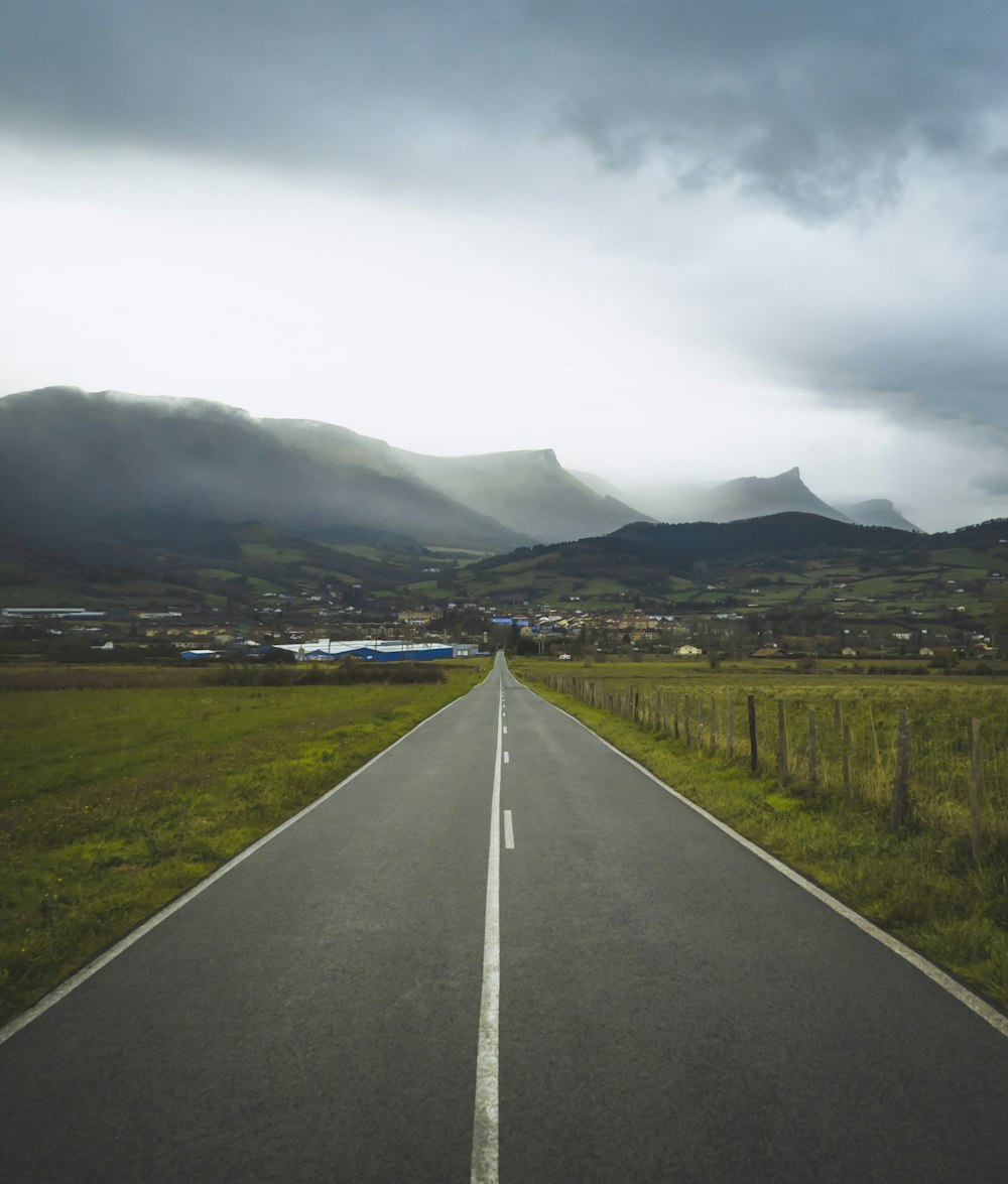 gray asphalt road and mountains