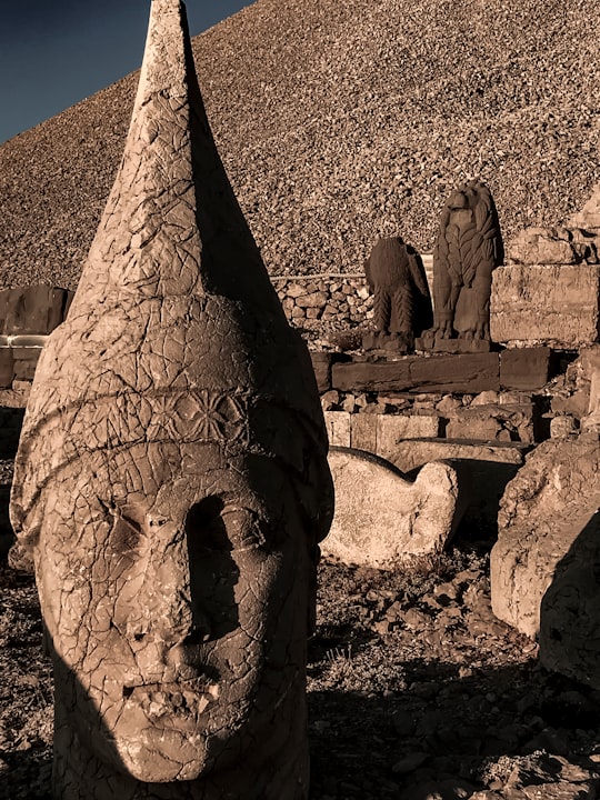 concrete statue at daytime in Mount Nemrut Turkey