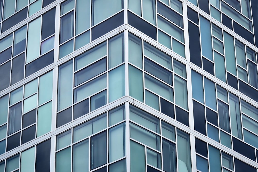 low angle photo of curtain glass wall building