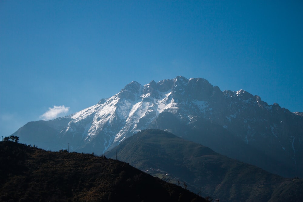 snow capped mountain range during daytime