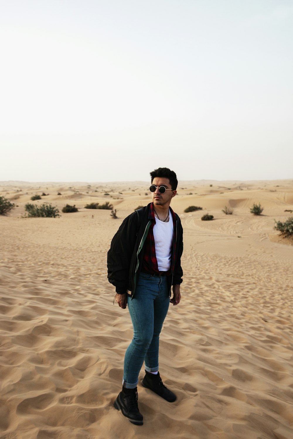 man standing on desert during daytime