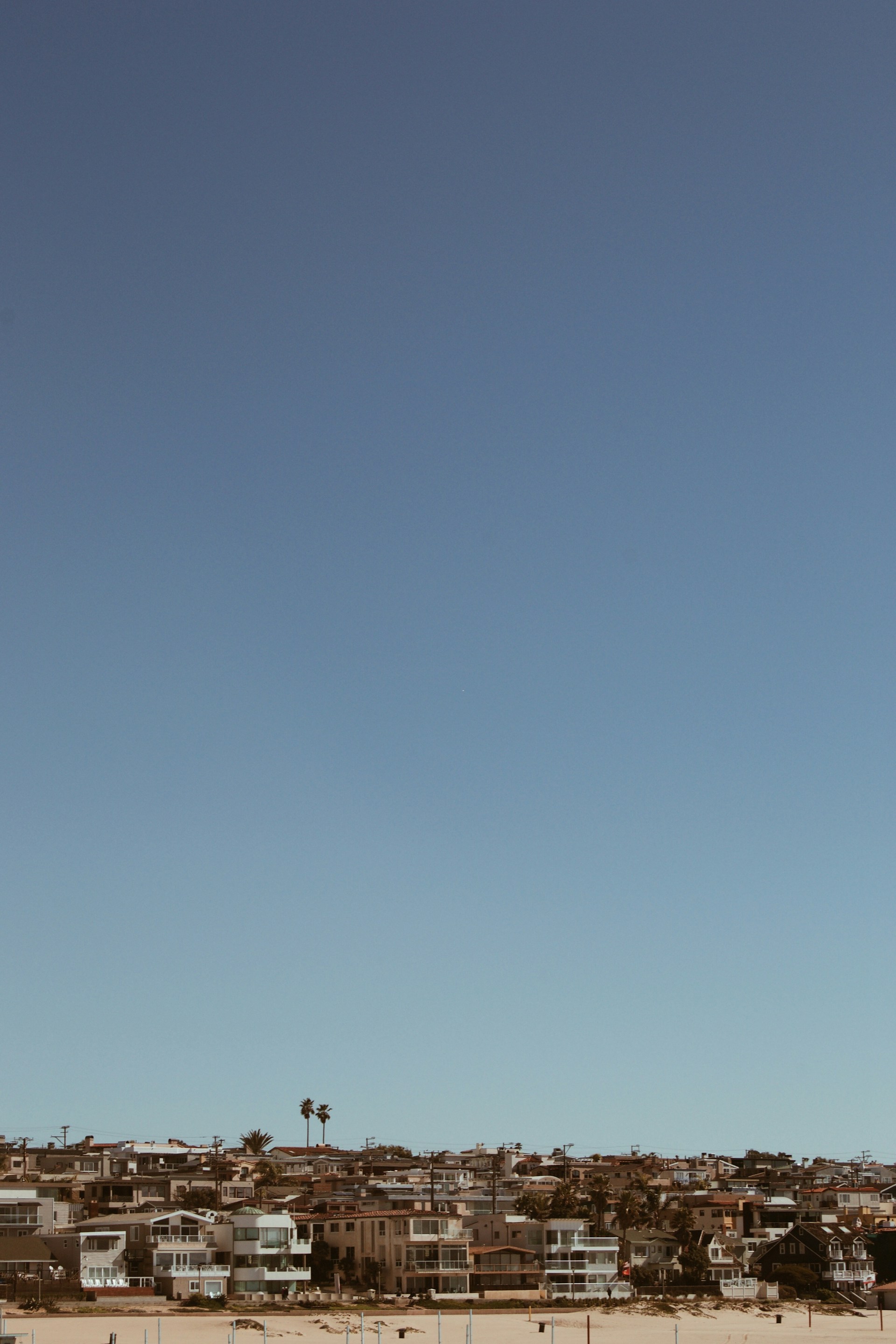 woman wearing yellow long-sleeved dress under white clouds and blue sky during daytime