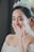 A bride smiling with her elegant hairstyle at her wedding.