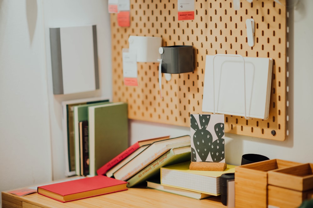 assorted books on brown wooden table