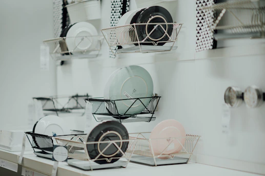 assorted-color saucers placed on rack