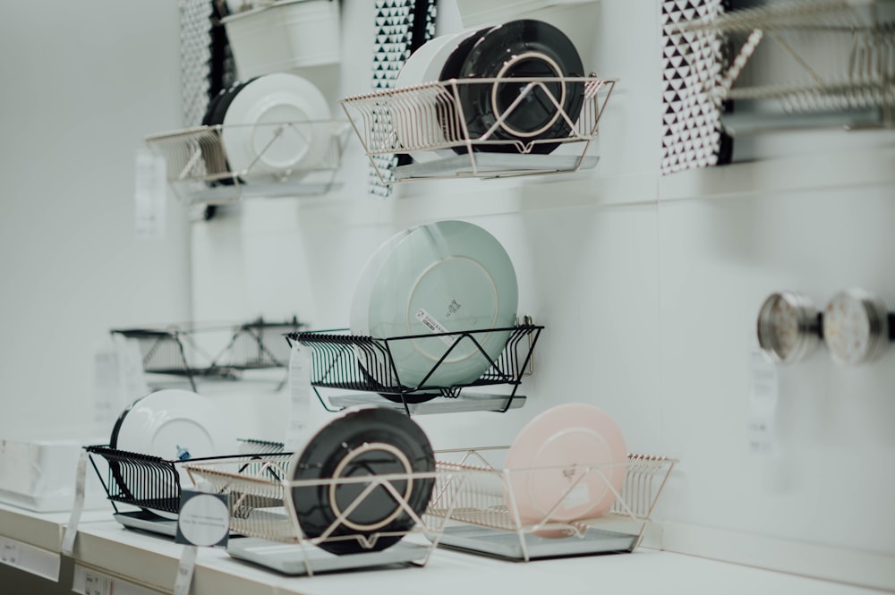 assorted-color saucers placed on rack