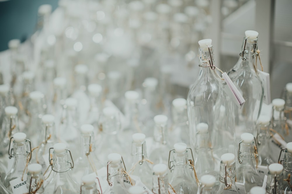 selective focus photo of clear glass bottles