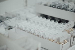 Rows of neatly organized boxes filled with packaged items labeled 'EDVALLA' displayed in an orderly fashion. The image showcases a retail or storage environment with a focus on product organization.