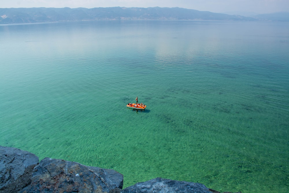 man on paddle board at sea