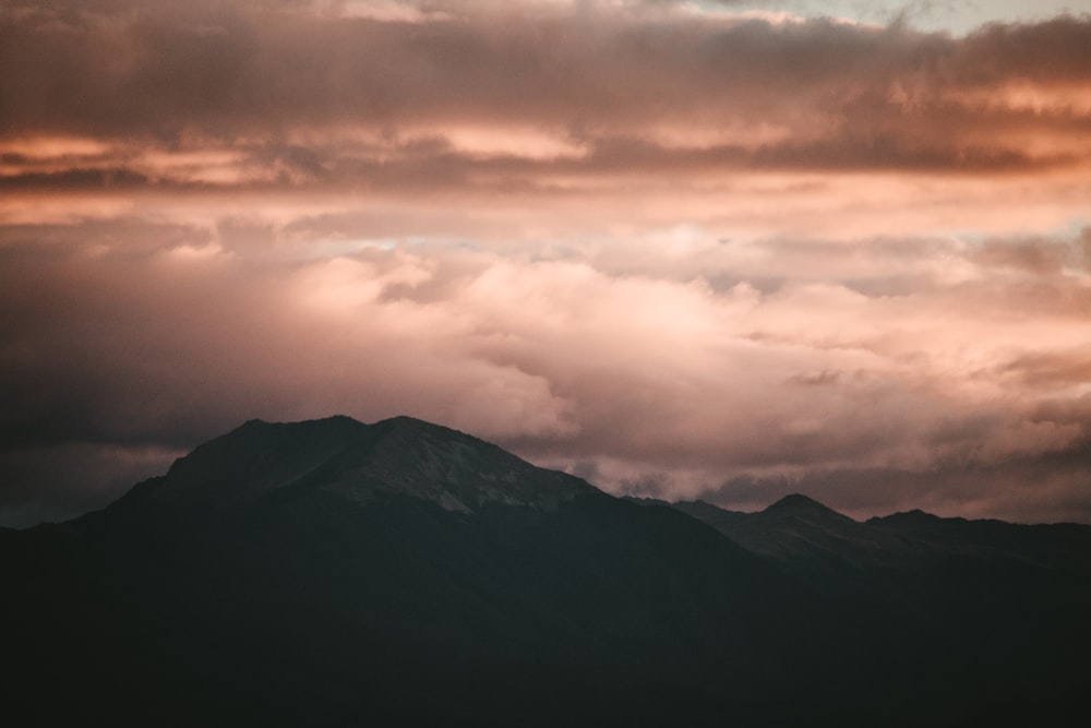 mountain under white clouds