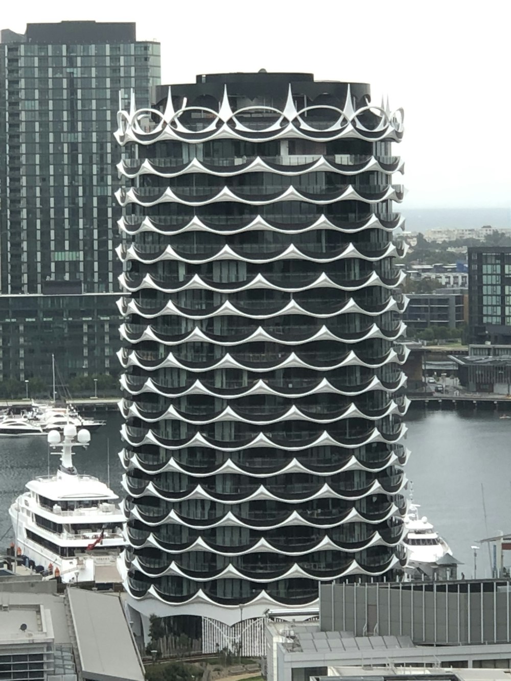 gray and black building near body of water during daytime