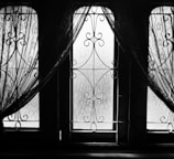 Elegant window frames and mosquito nets perfectly fitted in a bright room.